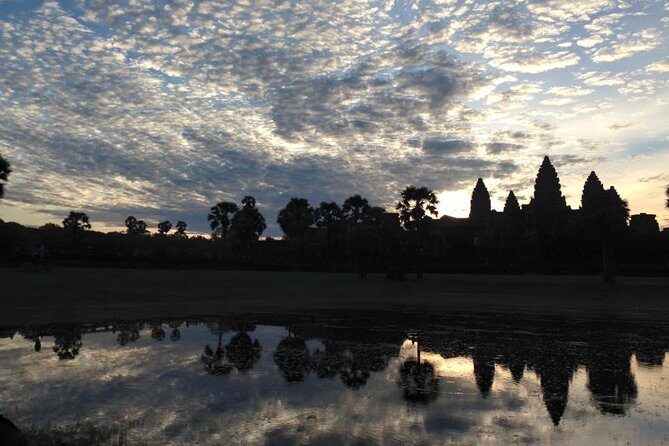 One Day tour with sunrise in car with A/C or Van & Guide. - Bayon in Angkor Thom: smiles, scale, and timing