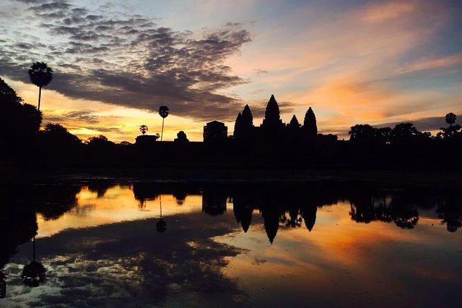 One Day tour with sunrise in car with A/C or Van & Guide. - Baphoun and Ta Prohm: when the day shifts from icons to atmosphere