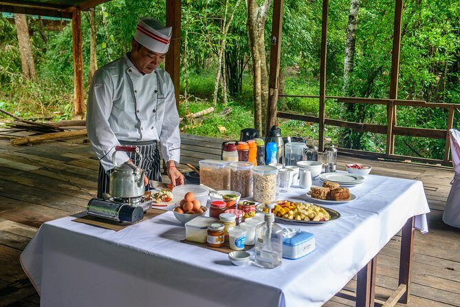 Siem Reap: Angkor Wat Sunrise Bike Tour & Jungle Breakfast - Bayon Temple: stone faces, city-center energy