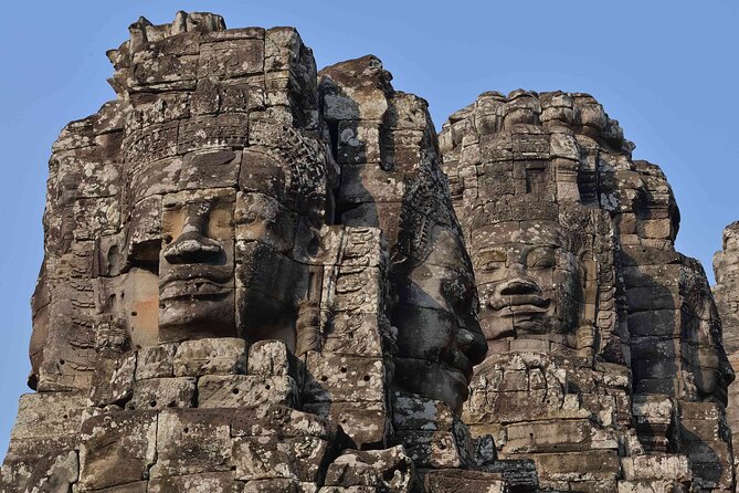2-Day Phnom Penh to Siem Reap and Angkor Wat Temples - Ta Prohm Jungle Roots, Angkor Thom’s Walls, and Bayon’s Four Faces